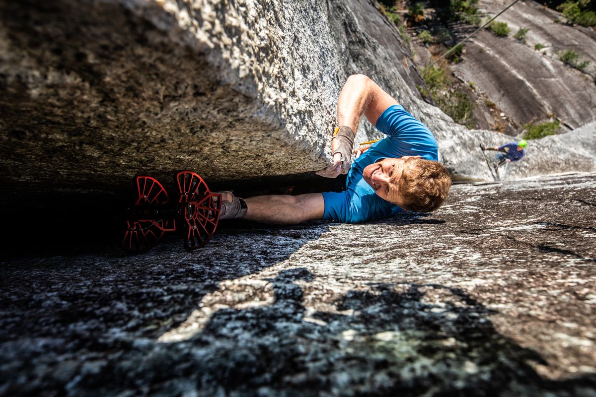 Rock climber jamming a granite crack on the Stawamus Chief, Squamish