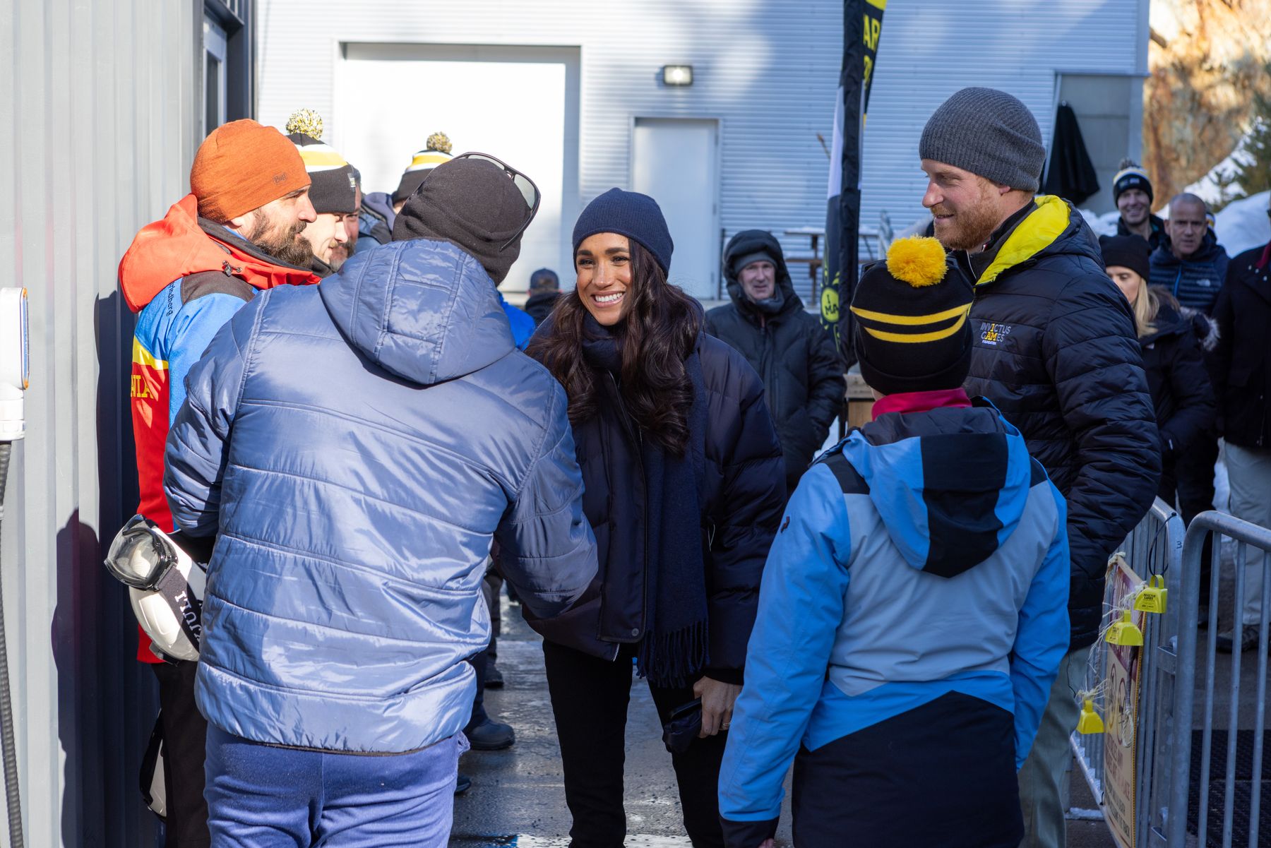 The Duchess of Sussex embracing a supporter at the Whistler Sliding Centre