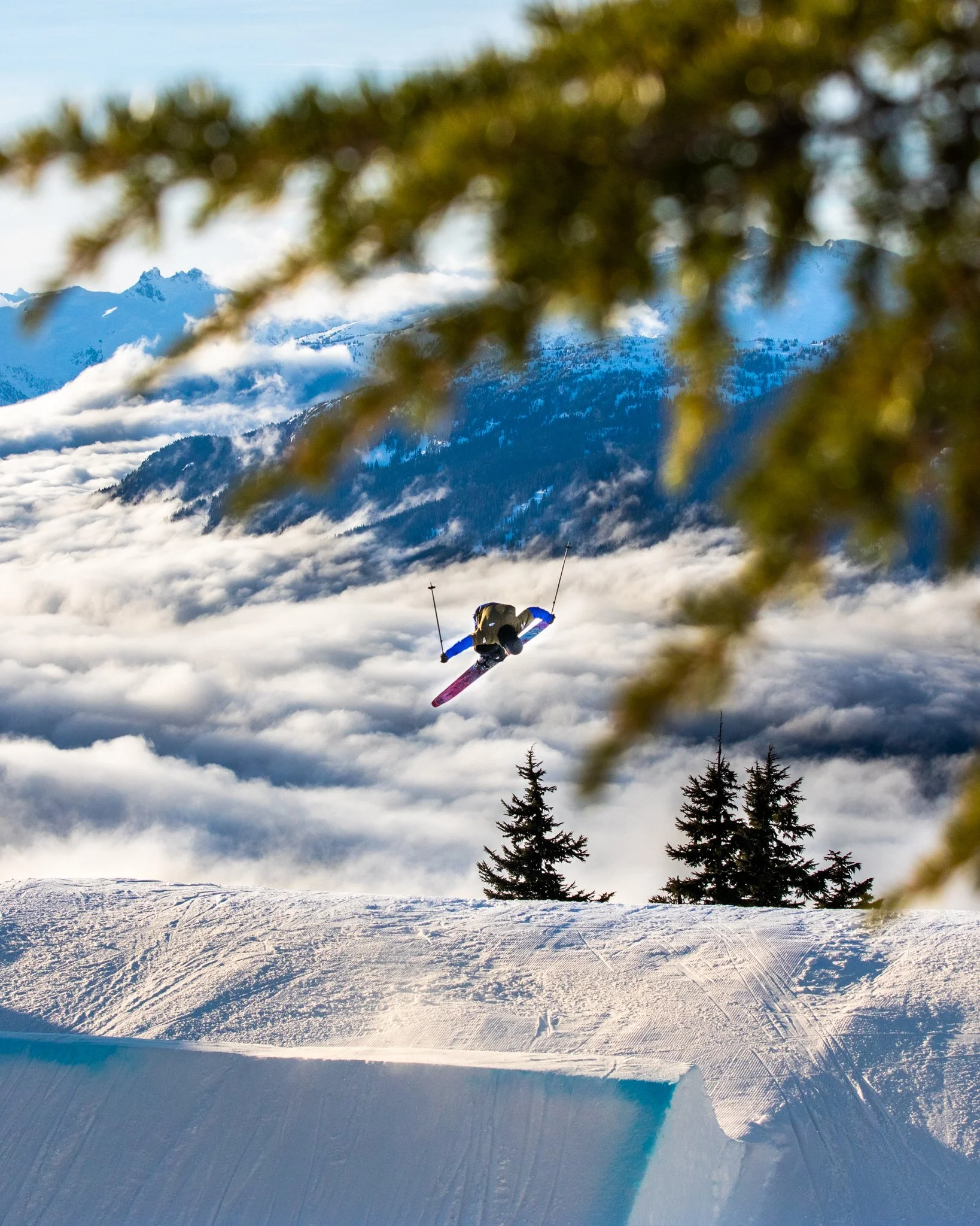 Skier carving through powder for Teton Gravity Research film