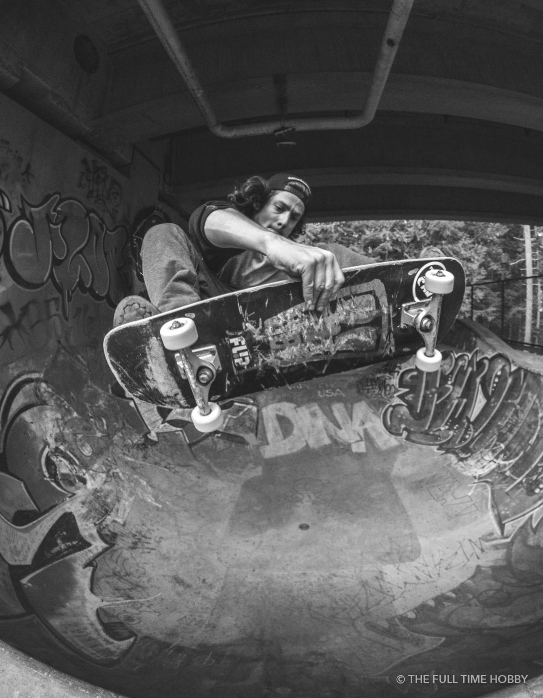 Skateboarder in the Bowl, Squamish skate park, Squamish, BC